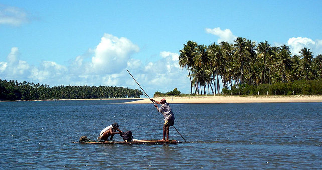 Fishermen at freshwater stream